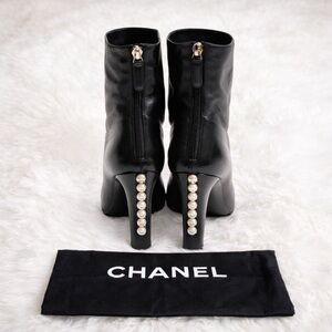 CHANEL Black Heeled Boots with Pearl Accent